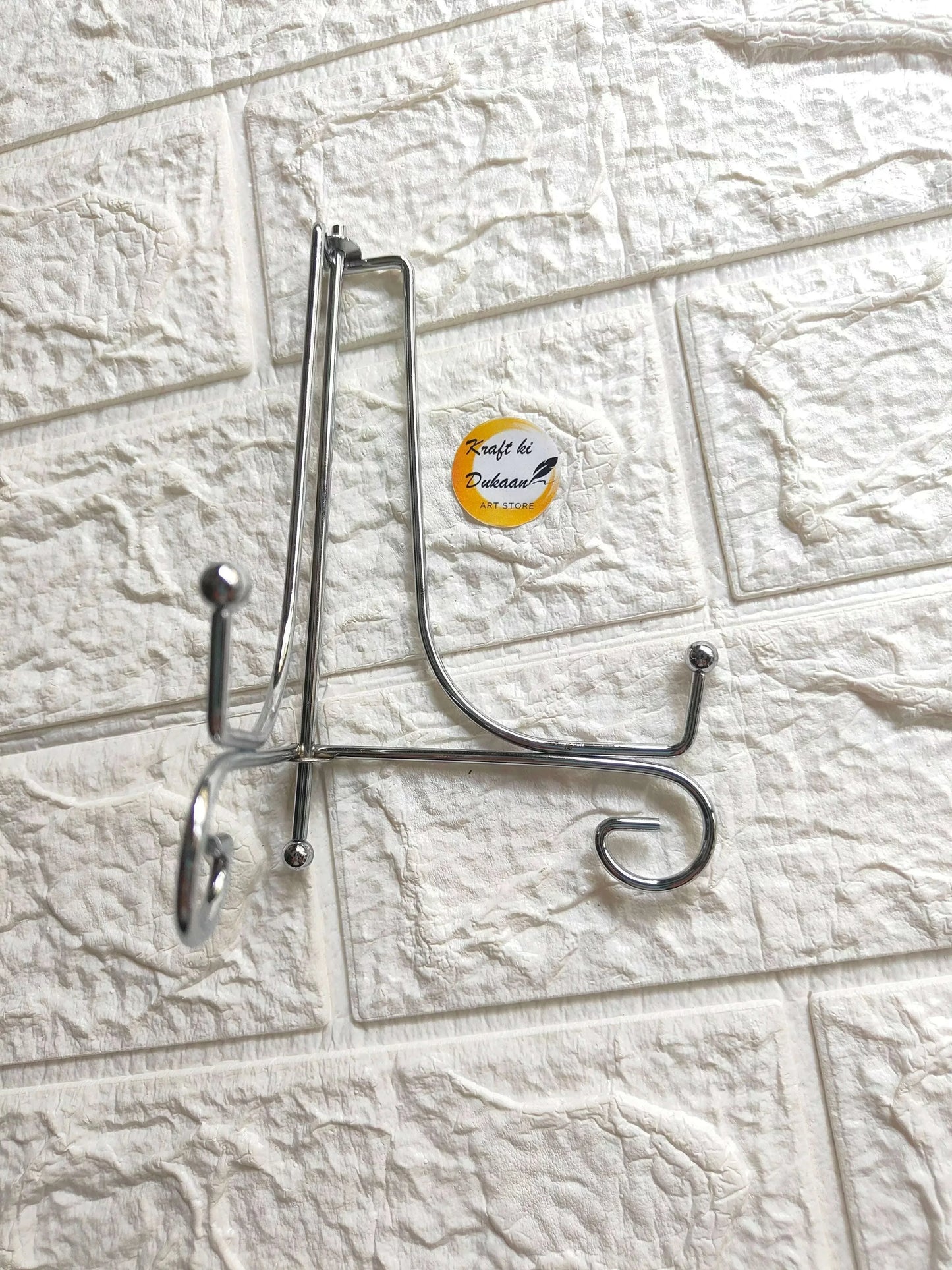 Foldable silver metal stand with side arm and hanging hook
