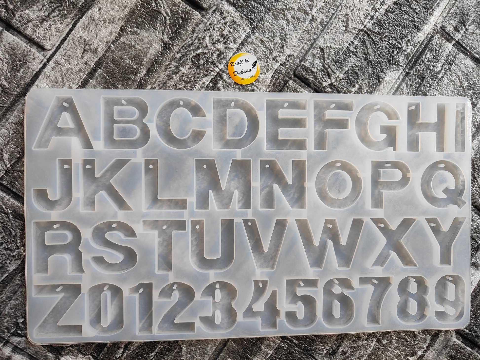 Front alphabet hole mold for resin art featuring letters A to Z and numbers 0 to 9 in clear silicone