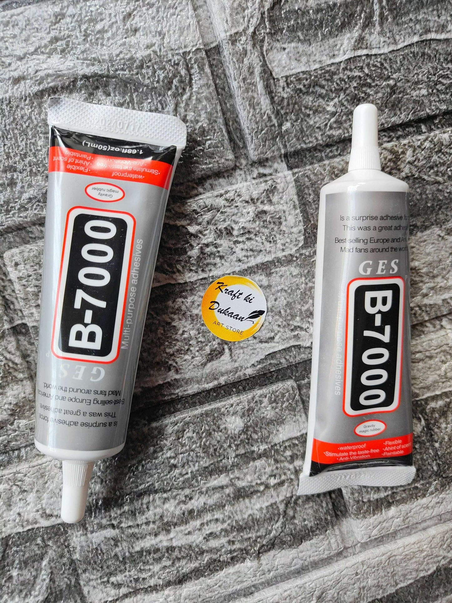 B7000 multi purpose glue tubes on a textured surface for crafting and repair projects