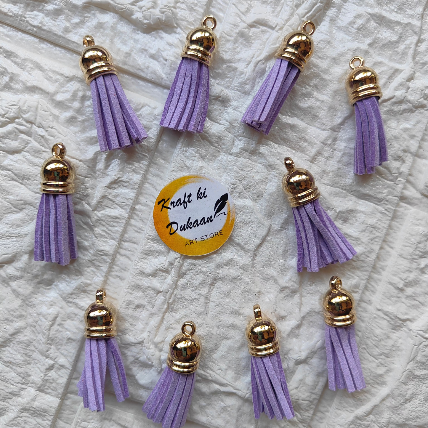 Gold Leather Tassel Craft in Lavender with Decorative Caps, perfect for DIY projects and accessories