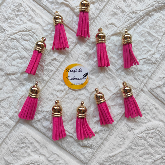 Gold Leather Tassel Craft in vibrant pink with metallic caps for creative projects and decorations