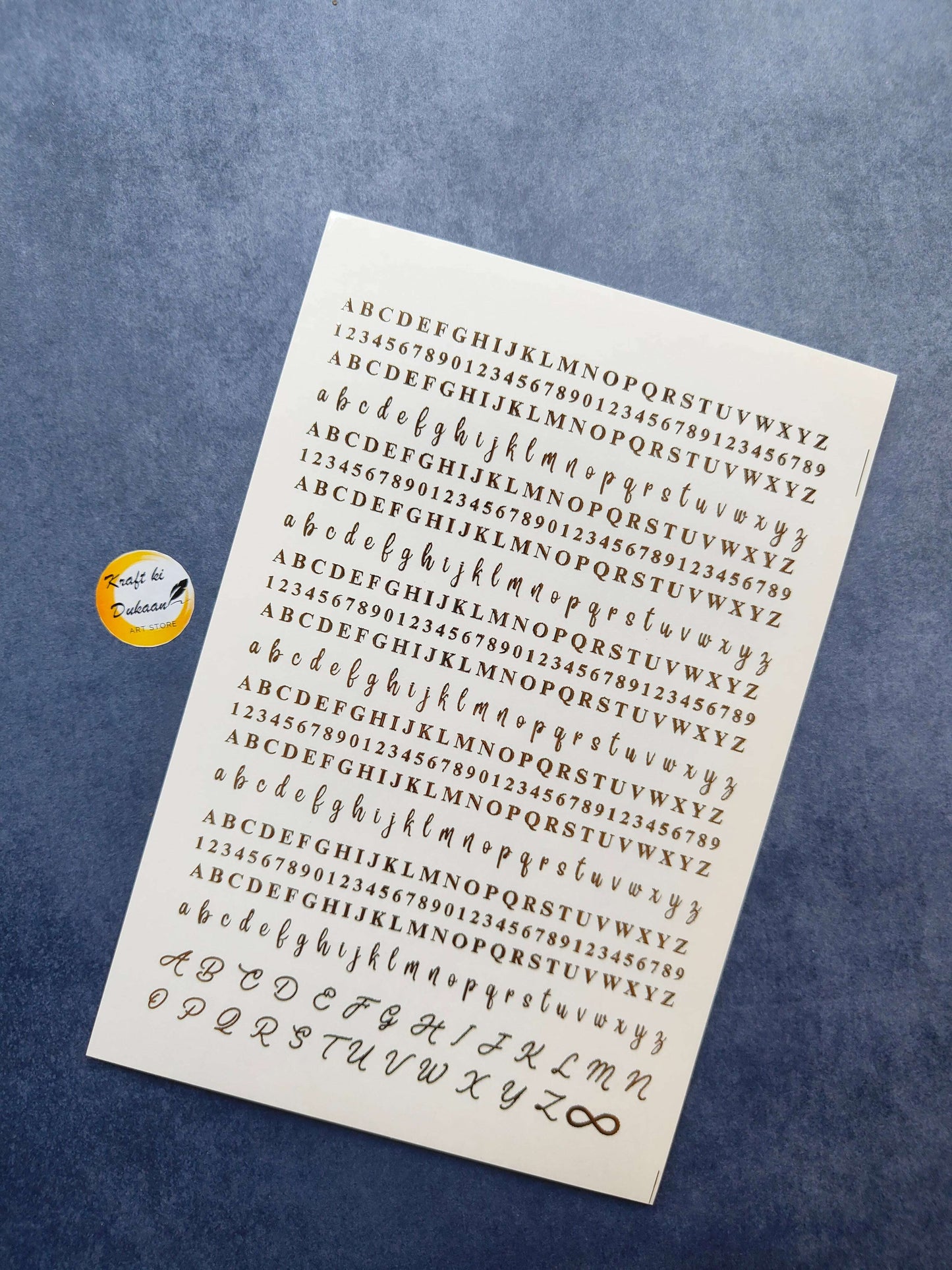 Gold metal alphabet sticker sheet featuring letters and numbers for creative crafts