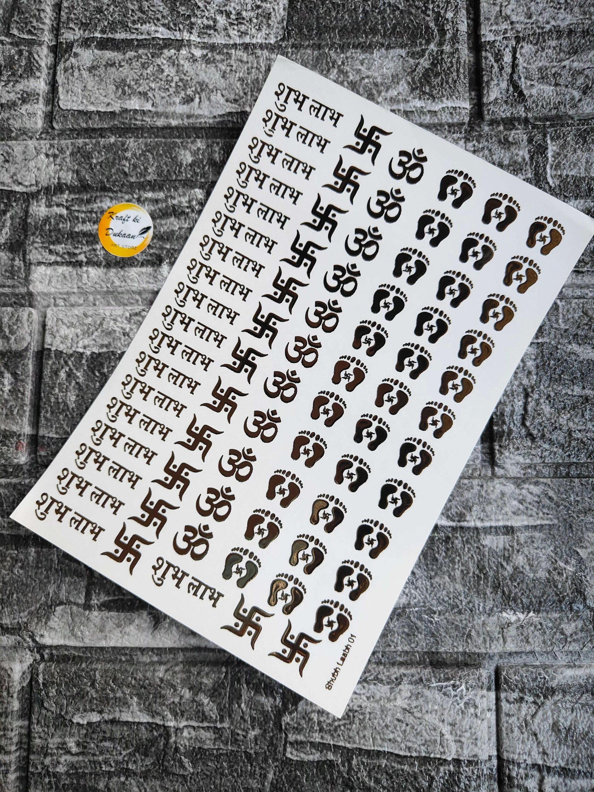 A5 gold embossed sticker sheet with Om symbols, footprints, and Hindi script