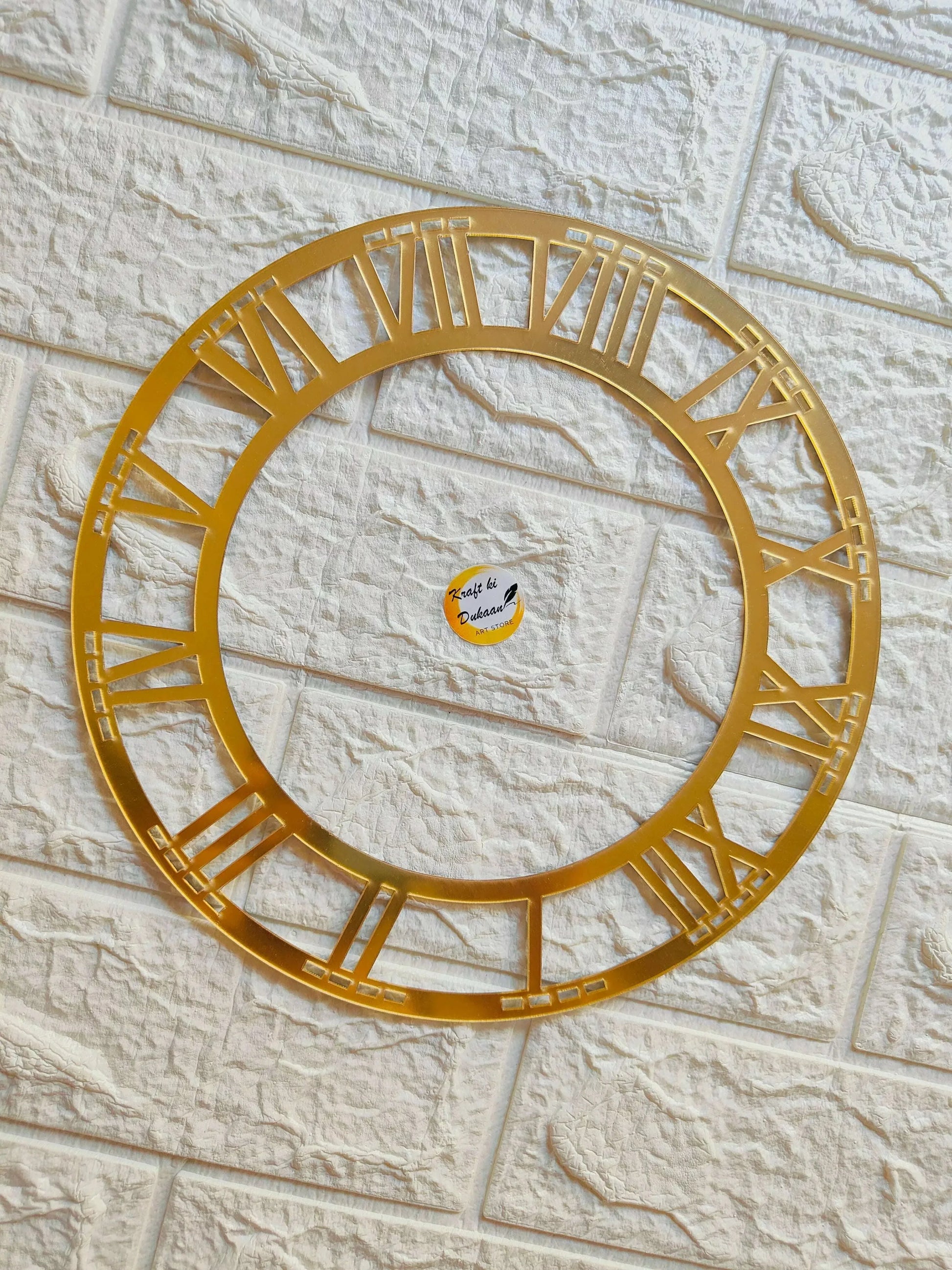 Golden acrylic Roman numeral clock ring, open circular frame with engraved hour index markings
