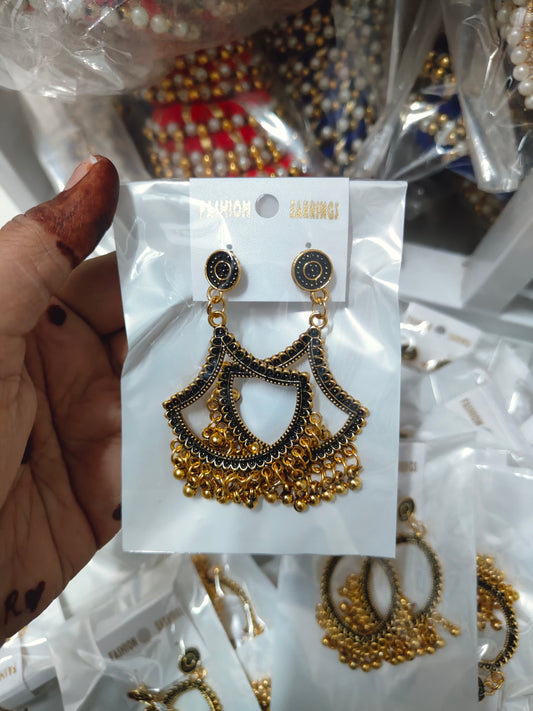 Golden earring jhumka with intricate design and dangling beads, perfect for festive occasions