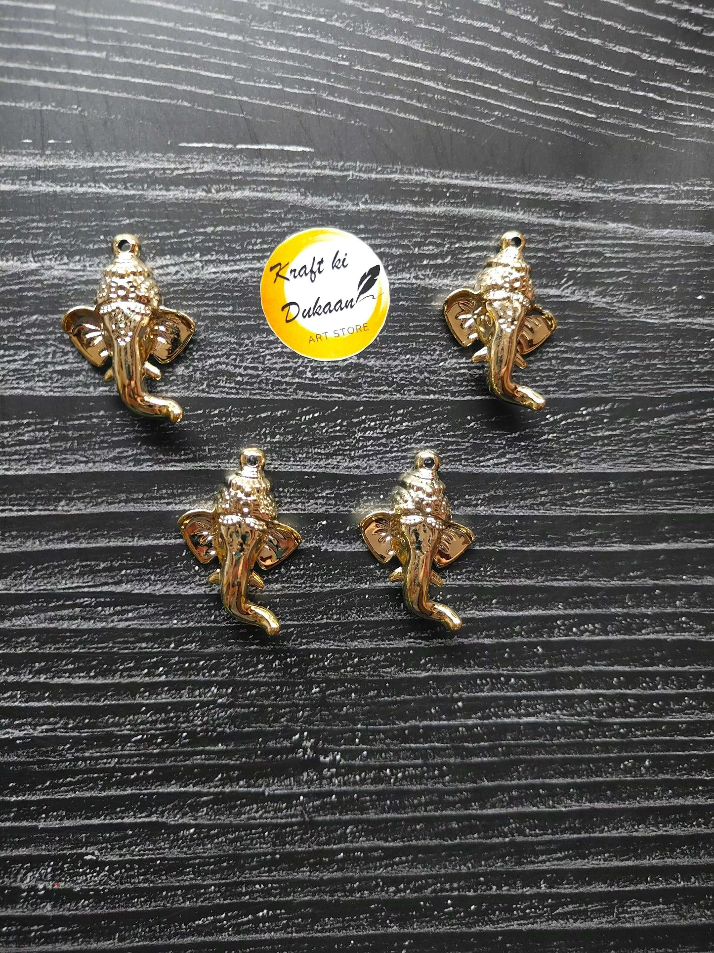 golden-ganpati-face-charms-flat-arrangement-group