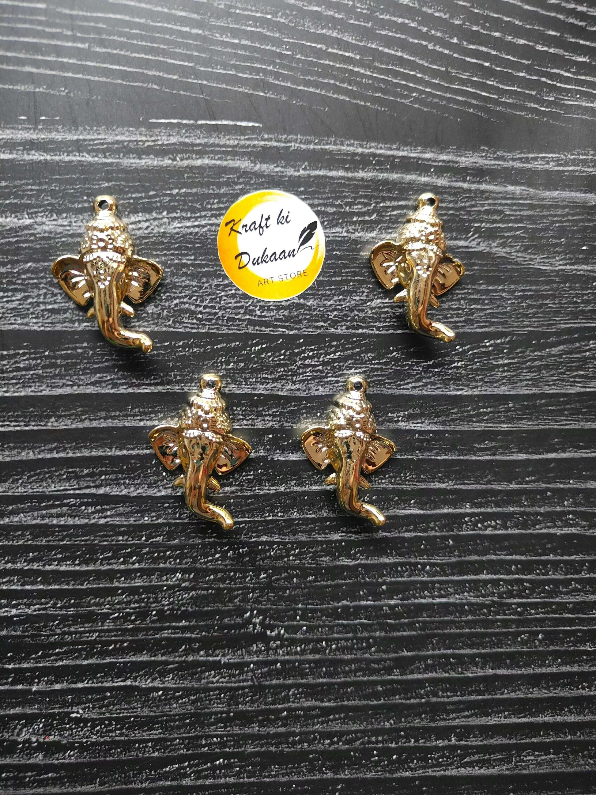 golden-ganpati-face-charms-flat-arrangement-group