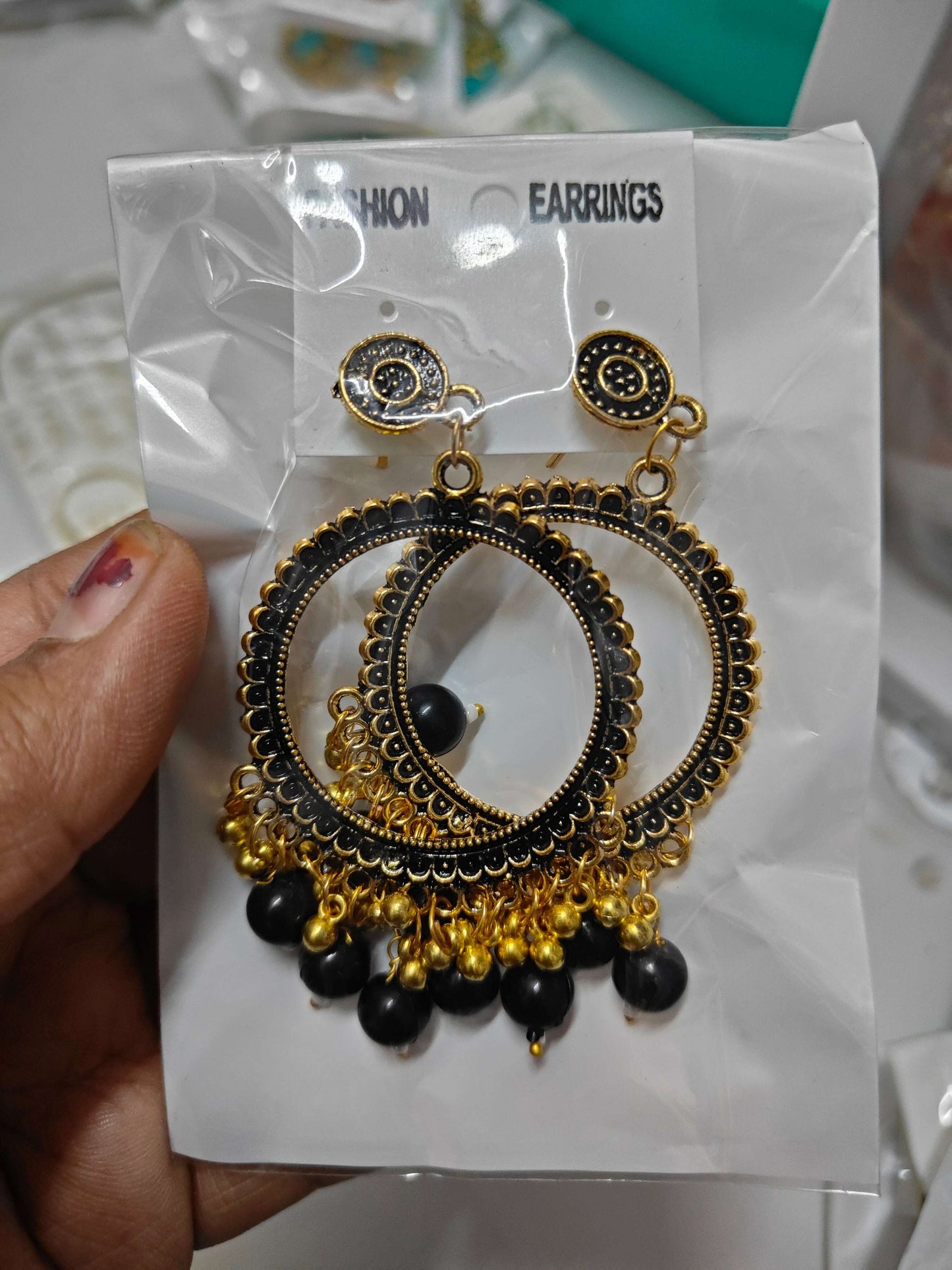 golden-jhumka-earrings-with-beads-black-beads