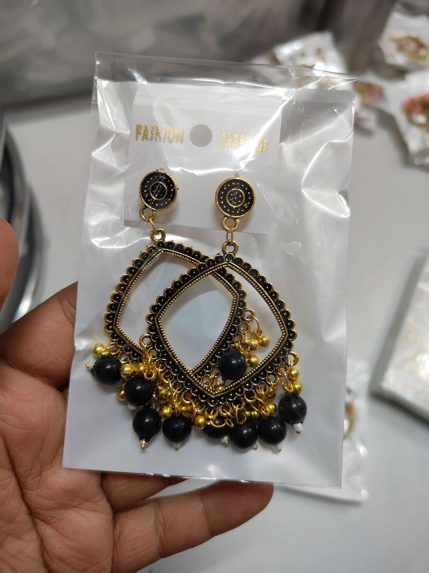 golden-jhumka-earrings-with-beads-black