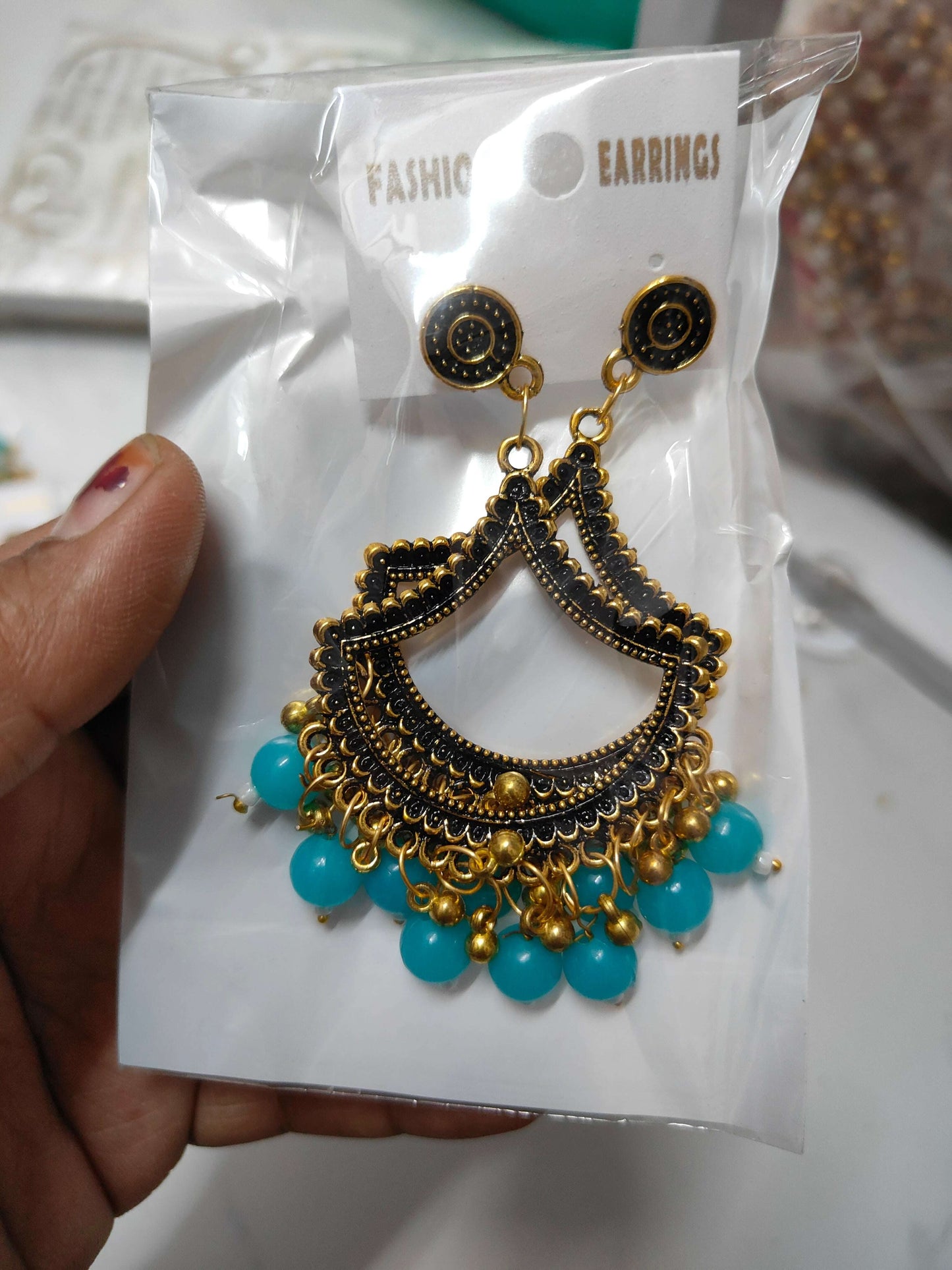 golden-jhumka-earrings-with-beads-blue-bead-detail