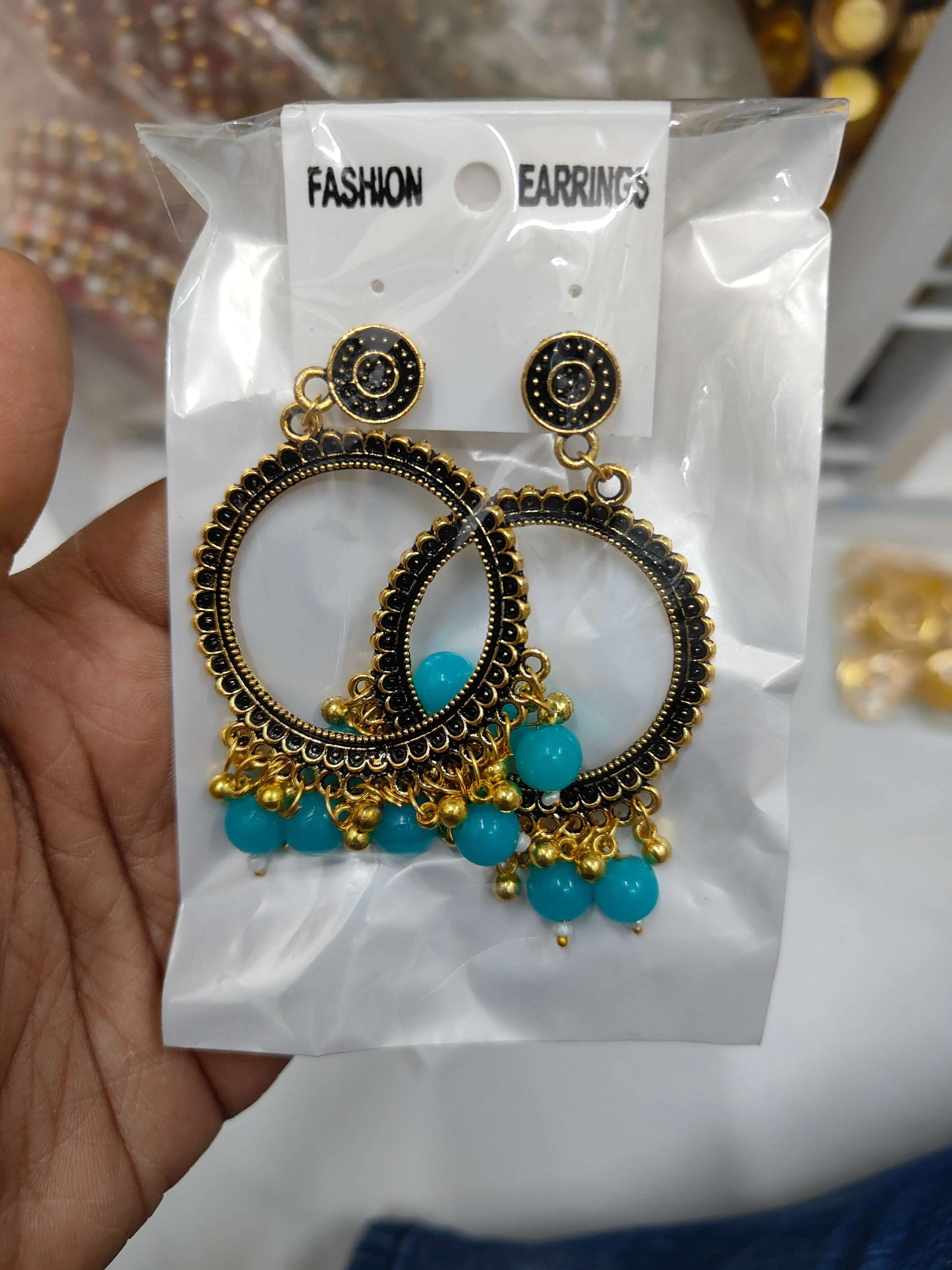 golden-jhumka-earrings-with-beads-blue-beads