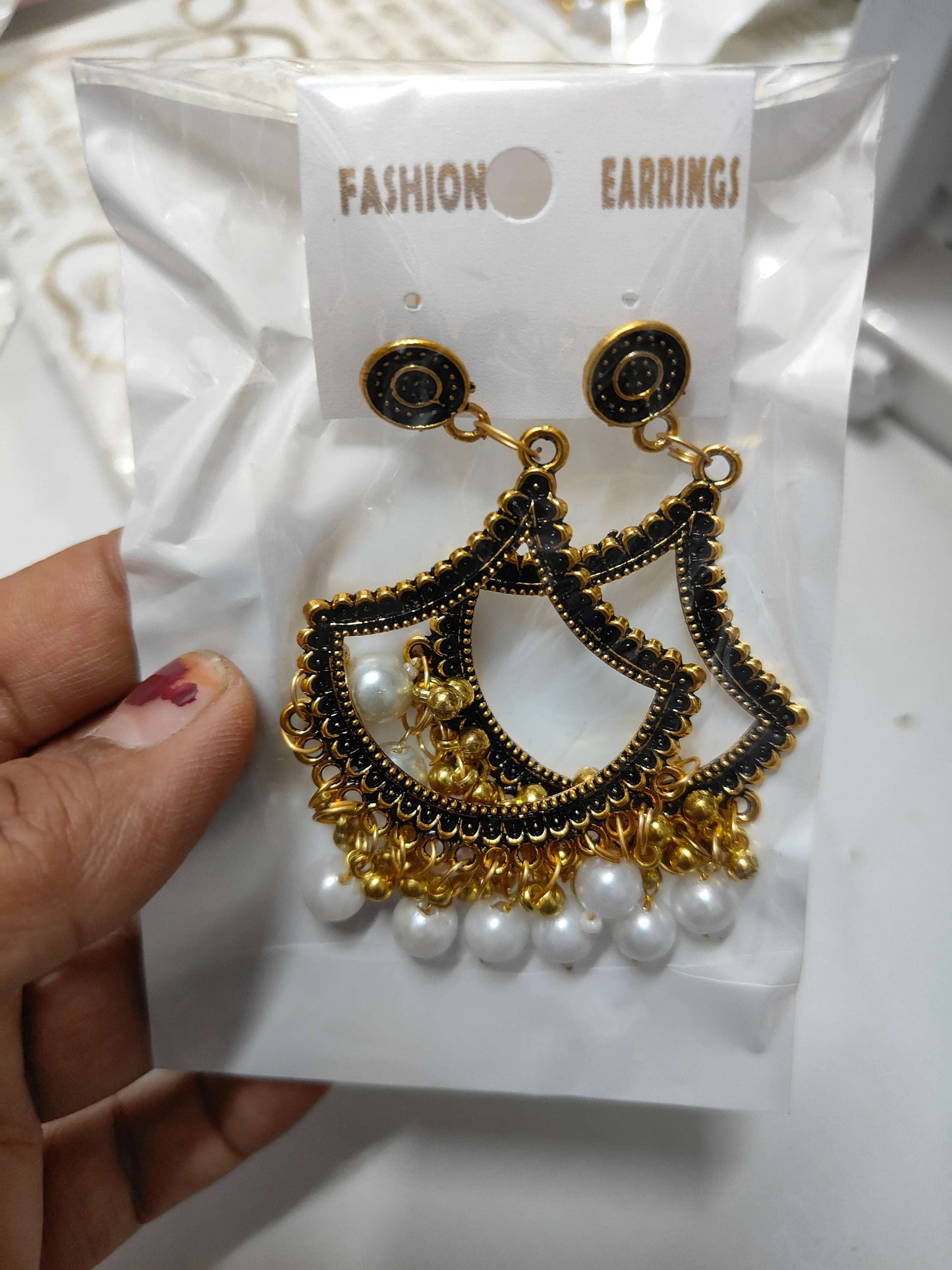 golden-jhumka-earrings-with-beads-white-bead-detail