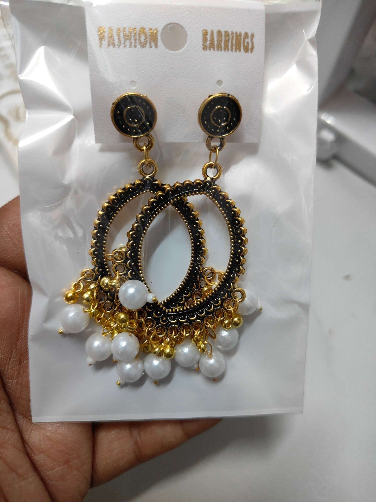 golden-jhumka-earrings-with-beads-white-beads