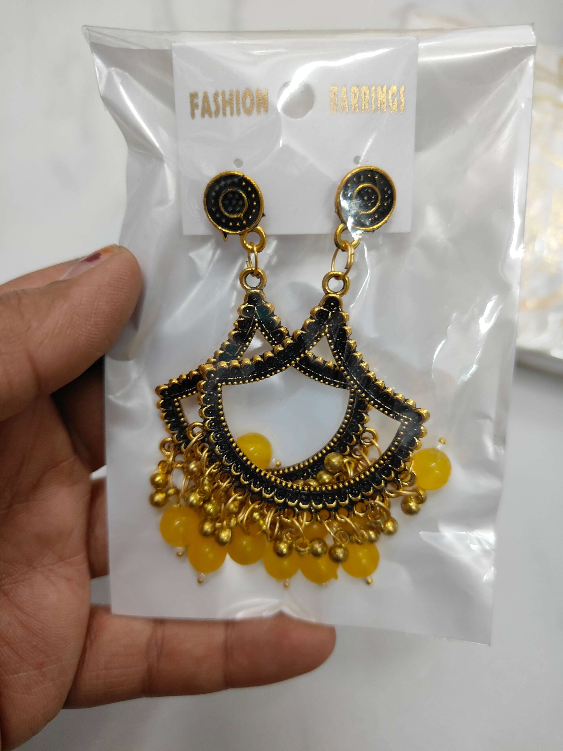 golden-jhumka-earrings-with-beads-yellow-bead-detail