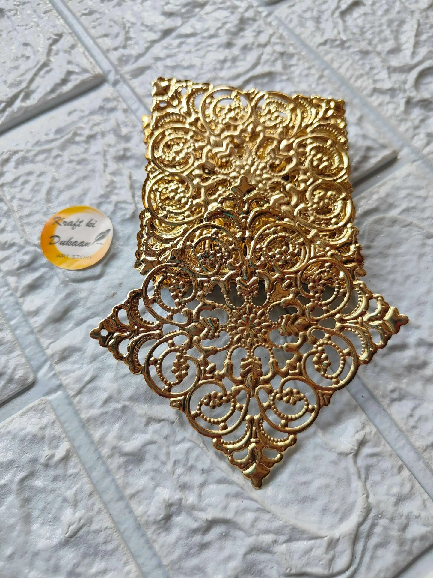 Golden decorative square tea light holder plate with intricate floral filigree