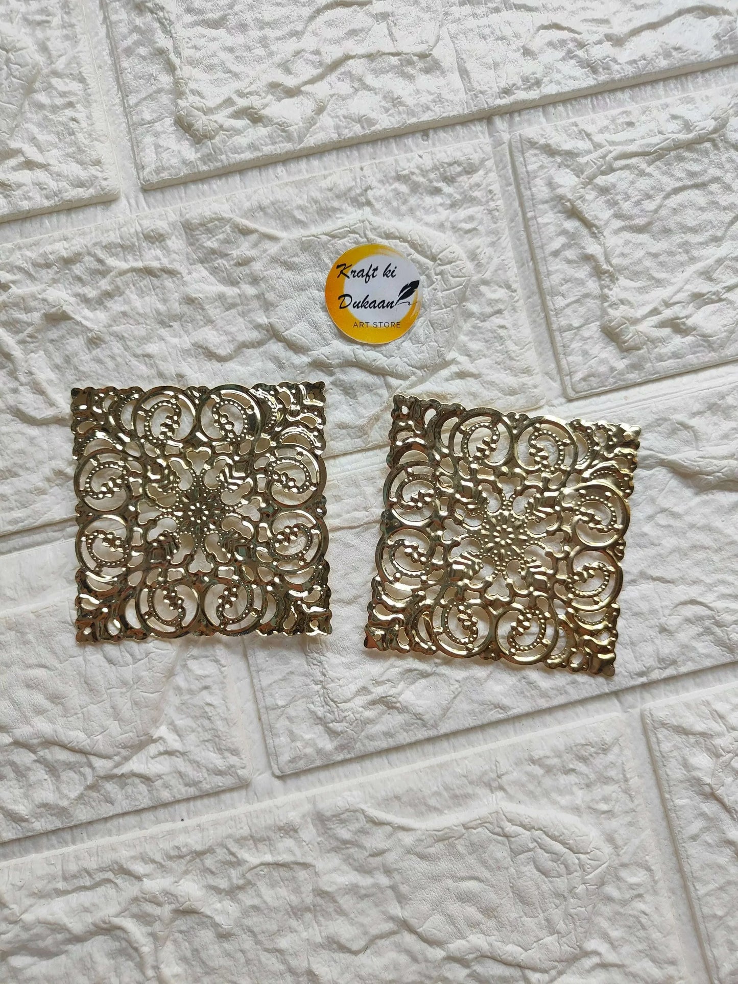 Golden square tea light plate with ornate filigree cutout pattern