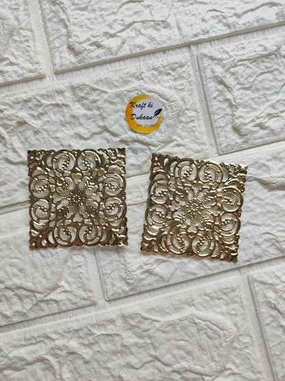 Golden square tea light plate with ornate filigree cutout pattern