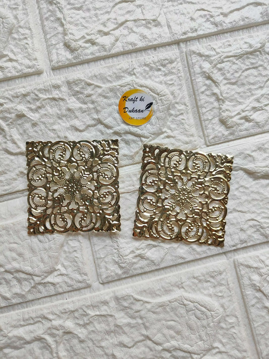 Golden square tea light plate with ornate filigree cutout pattern