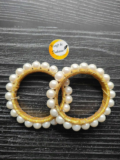 Round gota pearl ring with gold thread and white bead halo