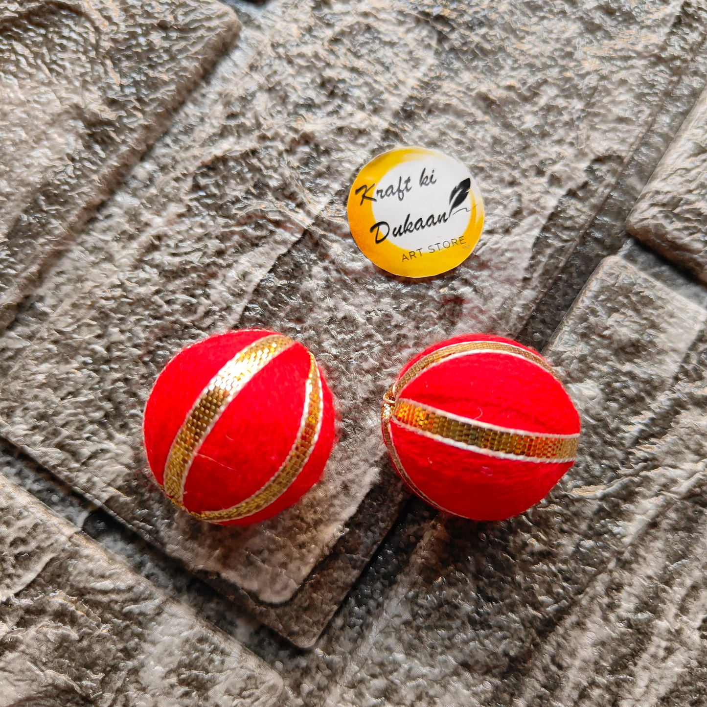 Gota Patti craft balls in vibrant red with decorative gold accents for festive decor