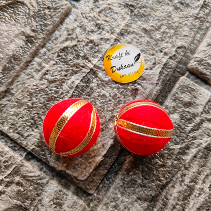 Gota Patti craft balls in vibrant red with decorative gold accents for festive decor