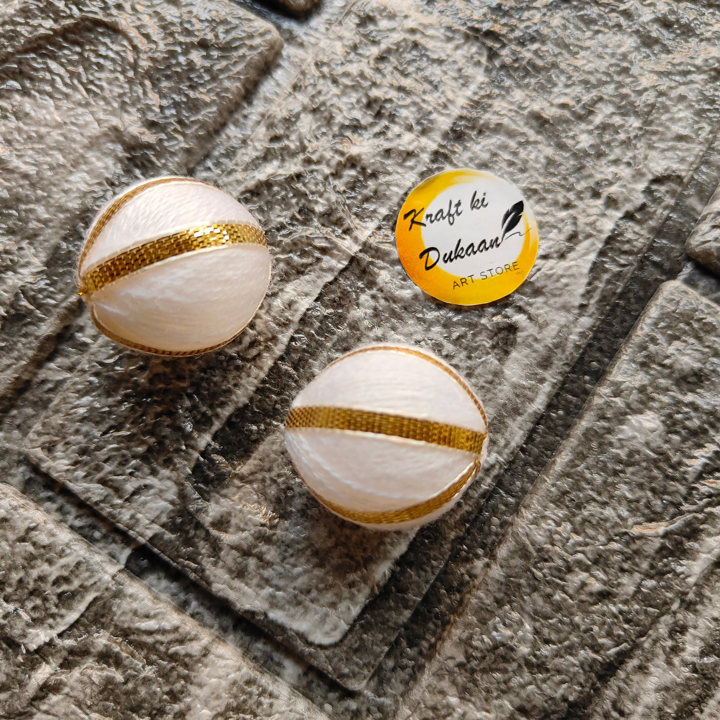 White Gota Patti craft balls with gold detailing from Kraft ki Dukaan for handmade decorations