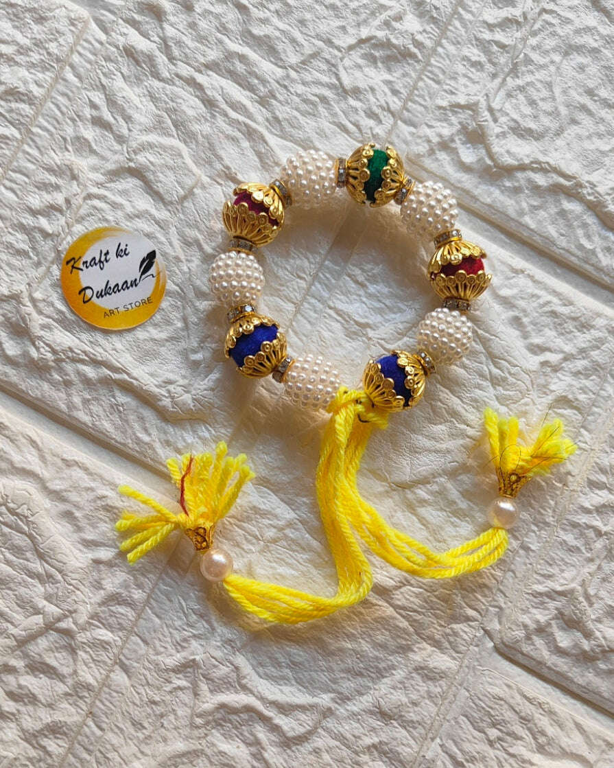 handmade-beaded-bracelet-gold-pearls-yellow-tassels