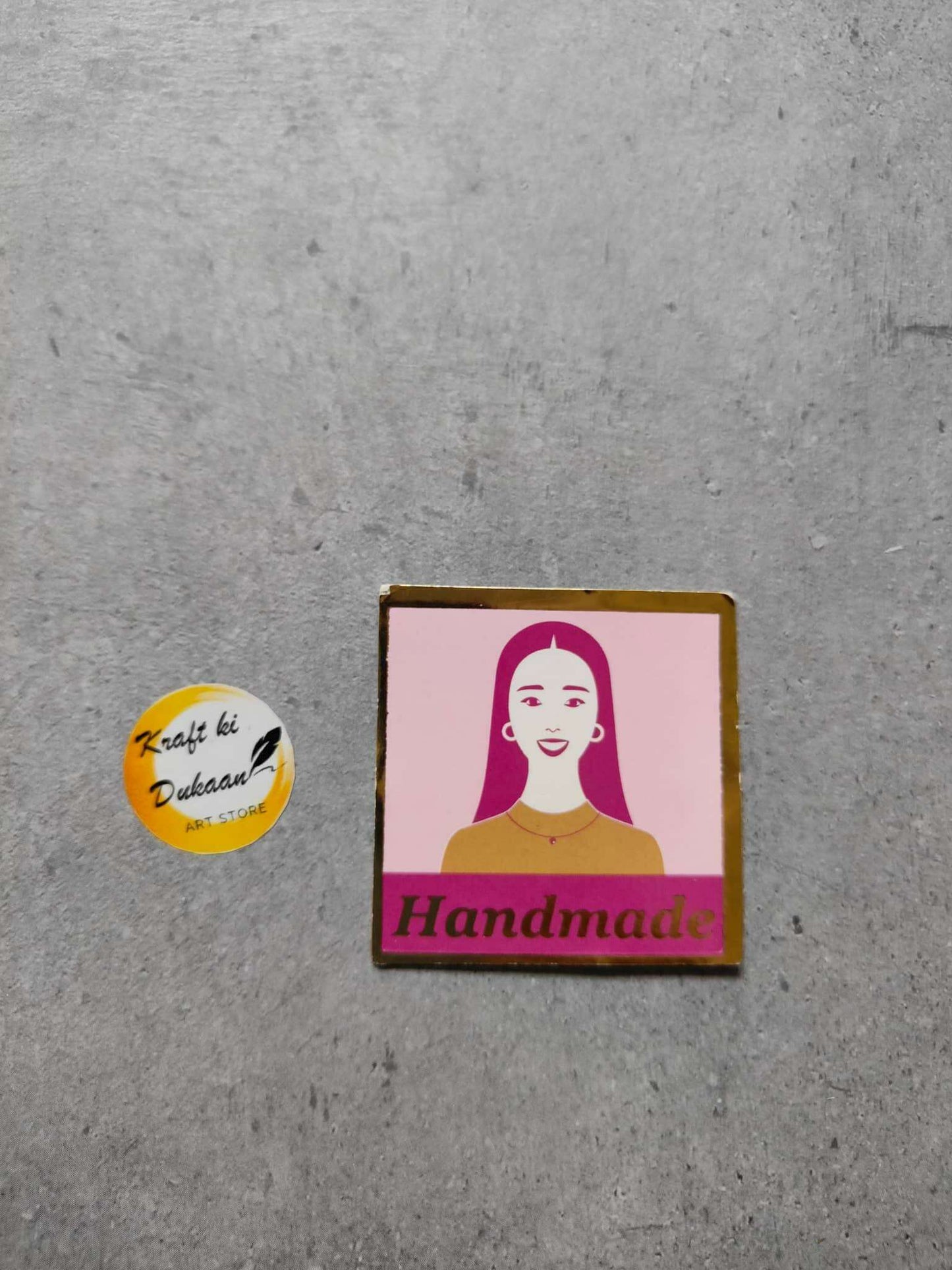 Jewellery card A11, 'Handmade' banner with portrait illustration, flat on grey surface
