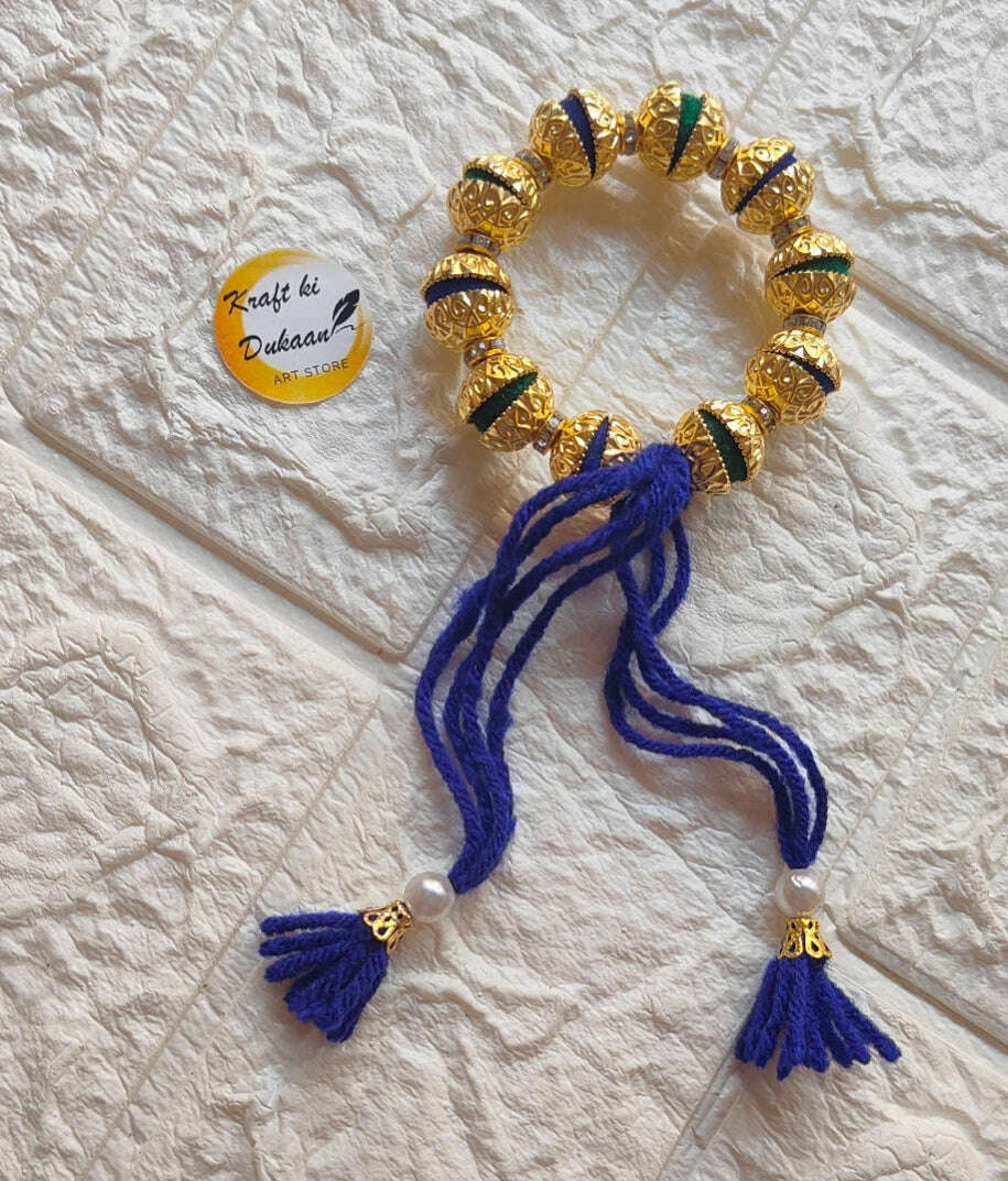handmade-resin-bracelet-gold-and-blue-tassels