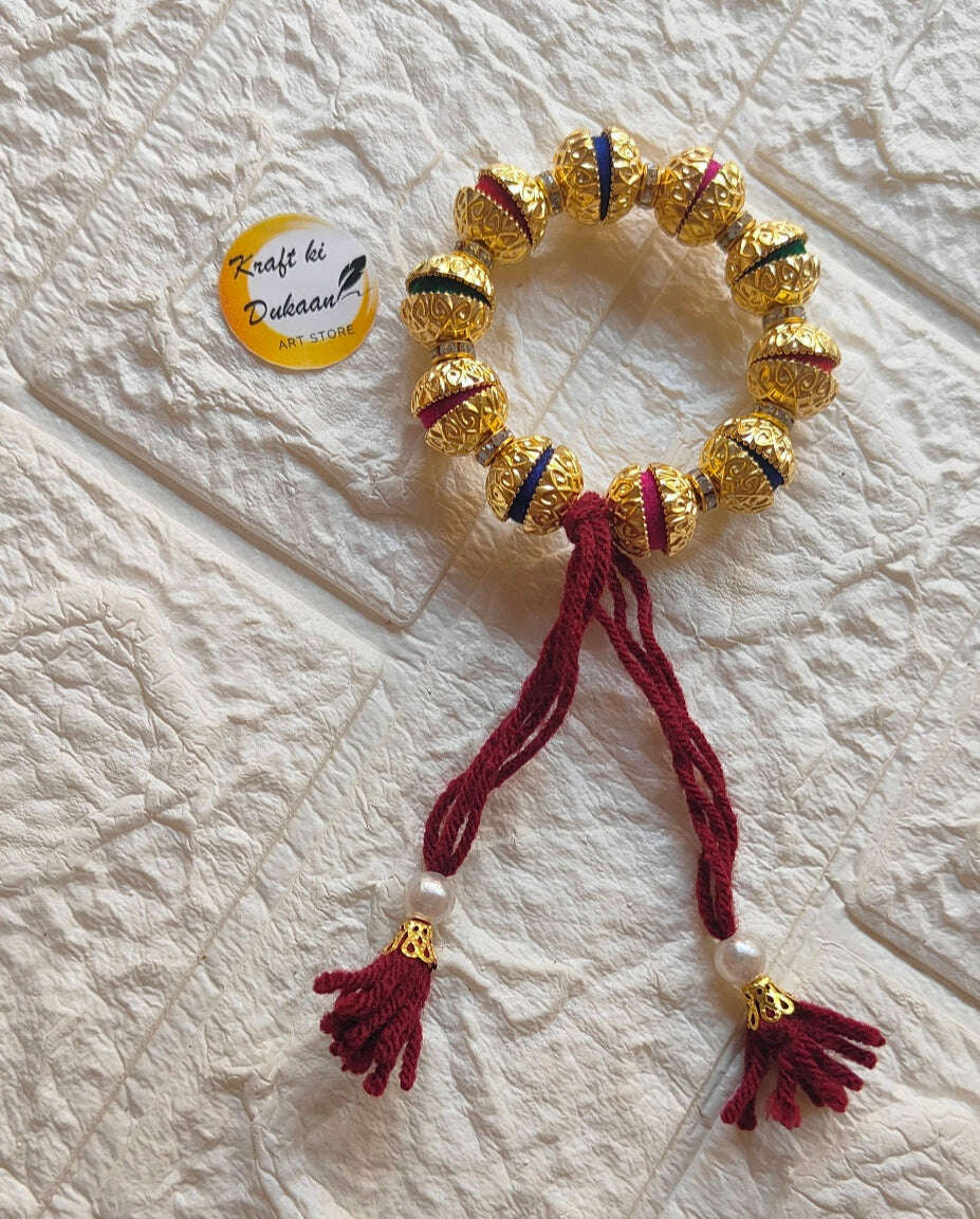 handmade-resin-bracelet-gold-and-maroon-tassels