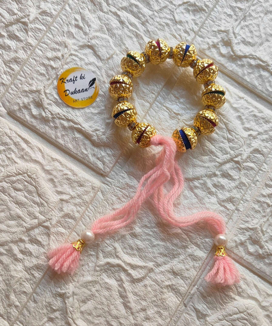 handmade-resin-bracelet-gold-and-pink-tassels