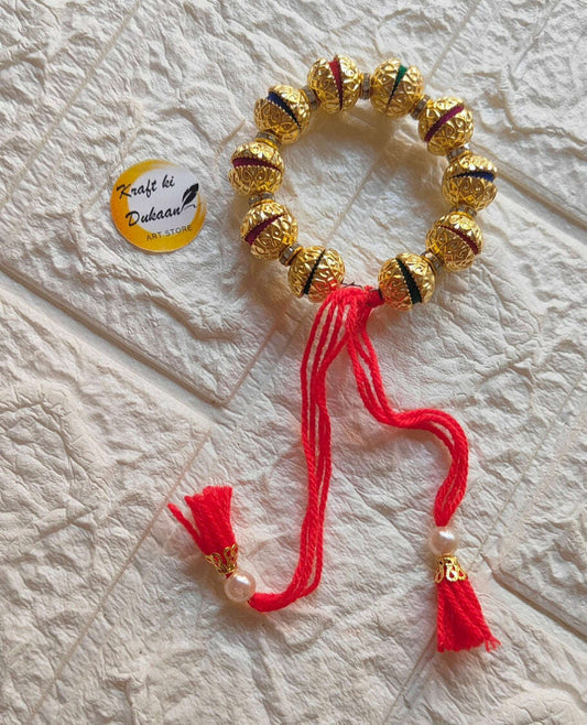 handmade-resin-bracelet-gold-and-red-tassels
