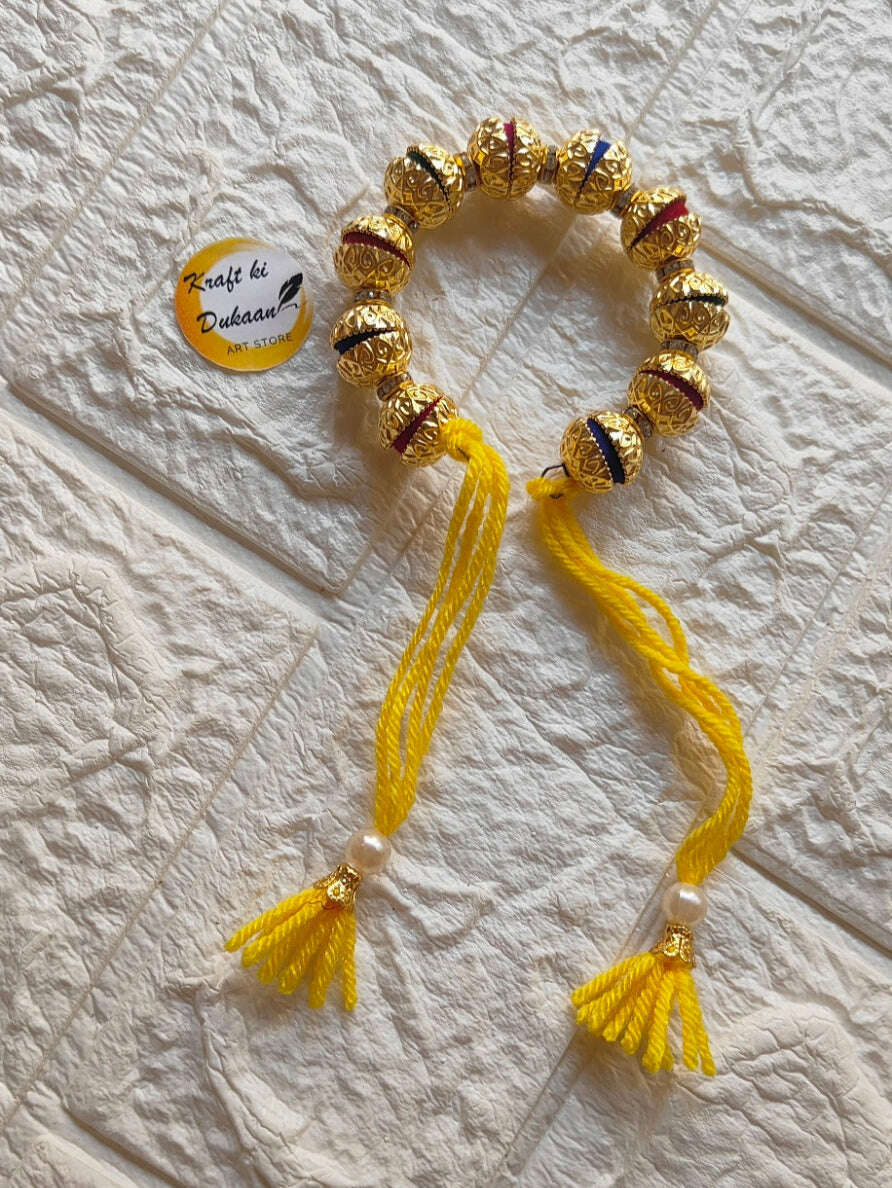handmade-resin-bracelet-gold-and-yellow-tassels