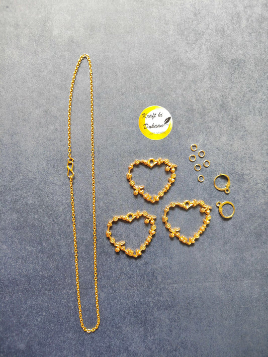Heart jewelry set with gold-tone necklace and heart earrings.