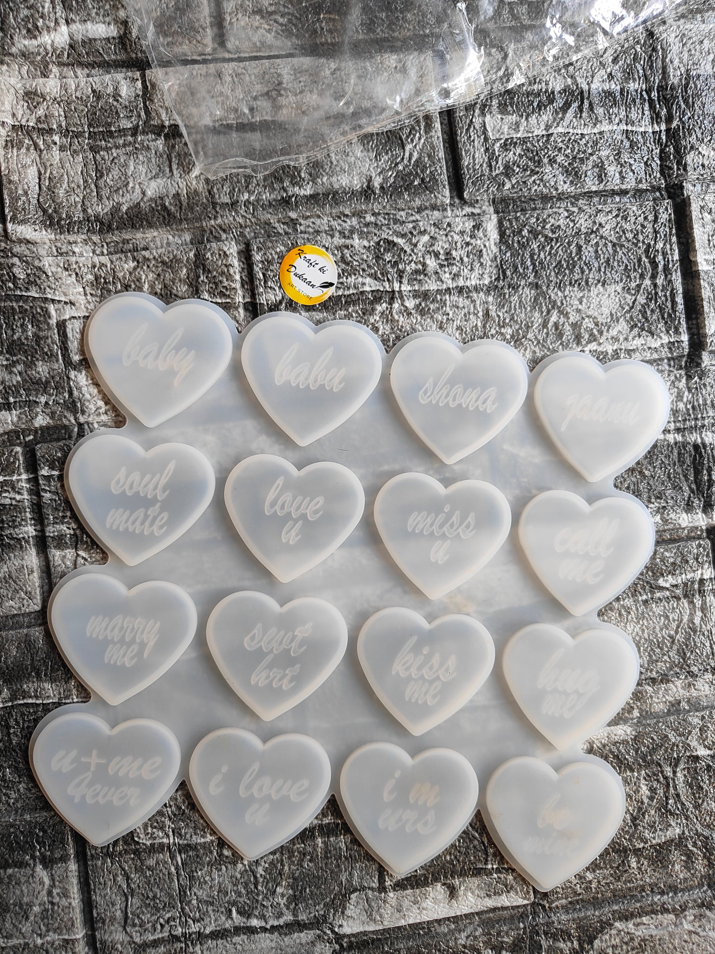 Set of heart molds for resin crafts featuring various love-themed inscriptions and a smooth finish