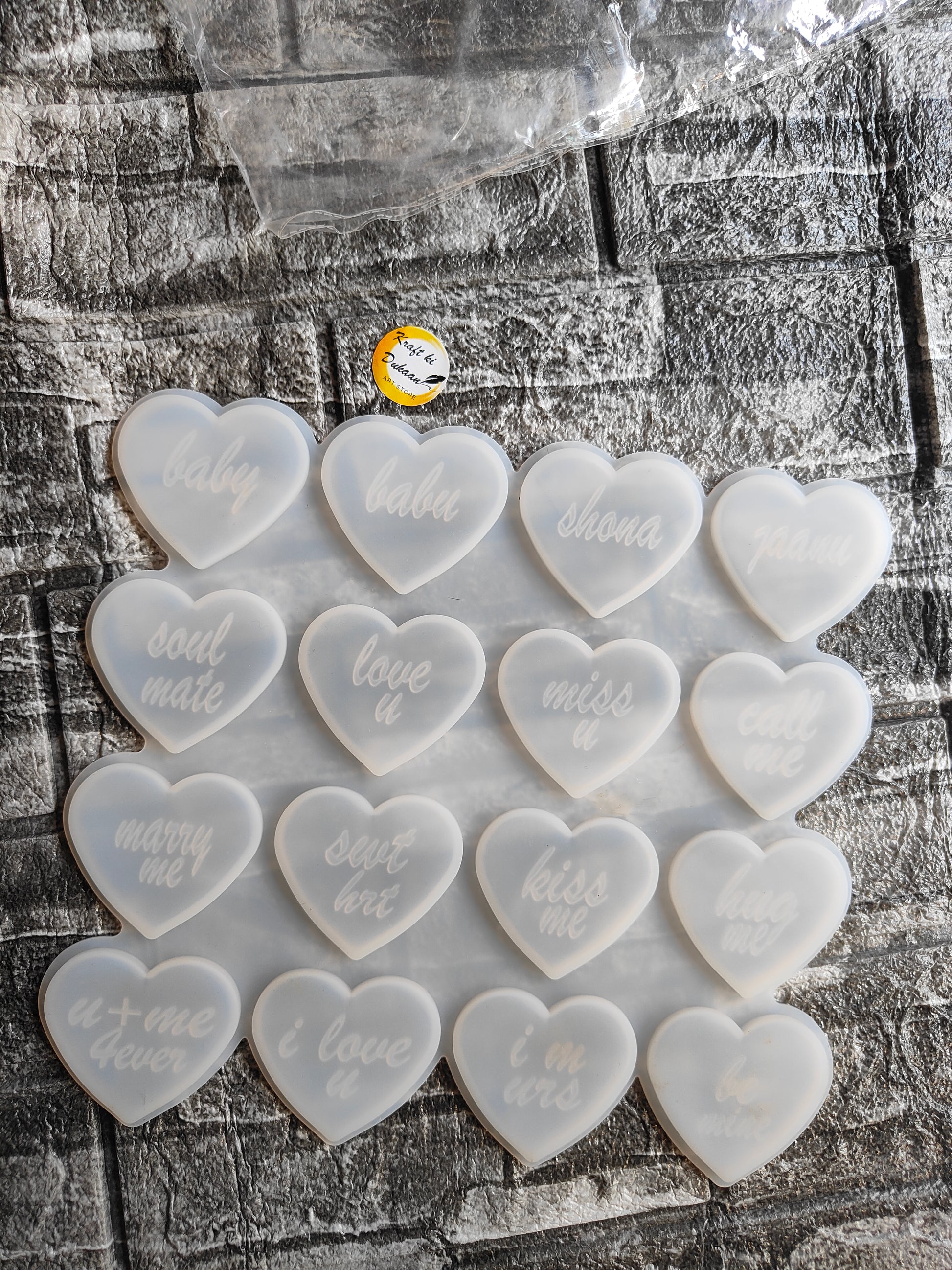 Set of heart molds for resin crafts featuring various love-themed inscriptions and a smooth finish