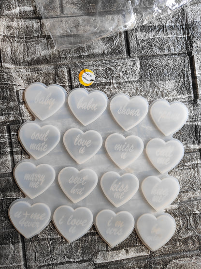 Set of heart molds for resin crafts featuring various love-themed inscriptions and a smooth finish