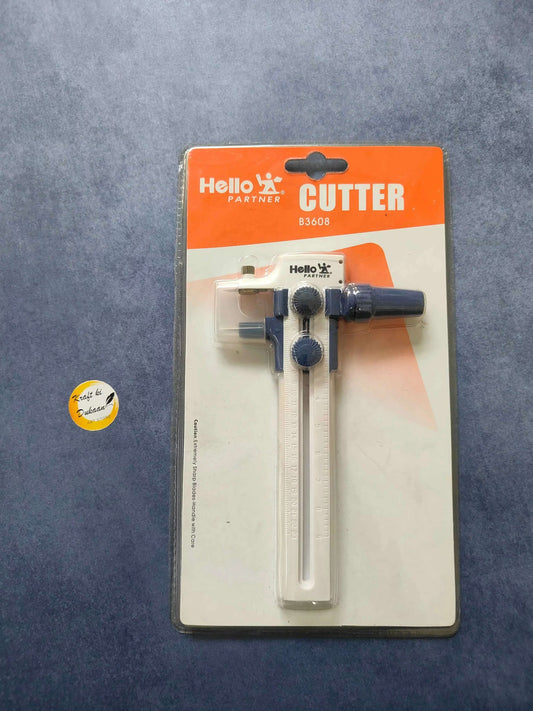 Circle cutter tool with adjustable cutting arm and guide wheel, in retail package