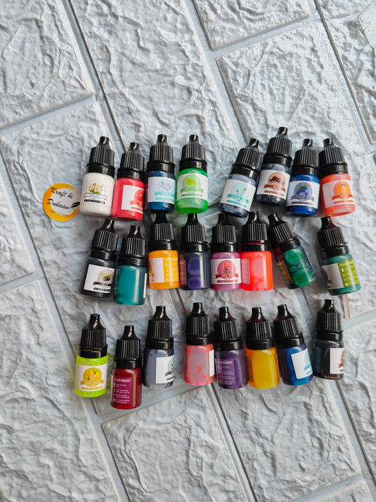 Assorted bottles of high concentrated resin pigments in vibrant colors for creative projects