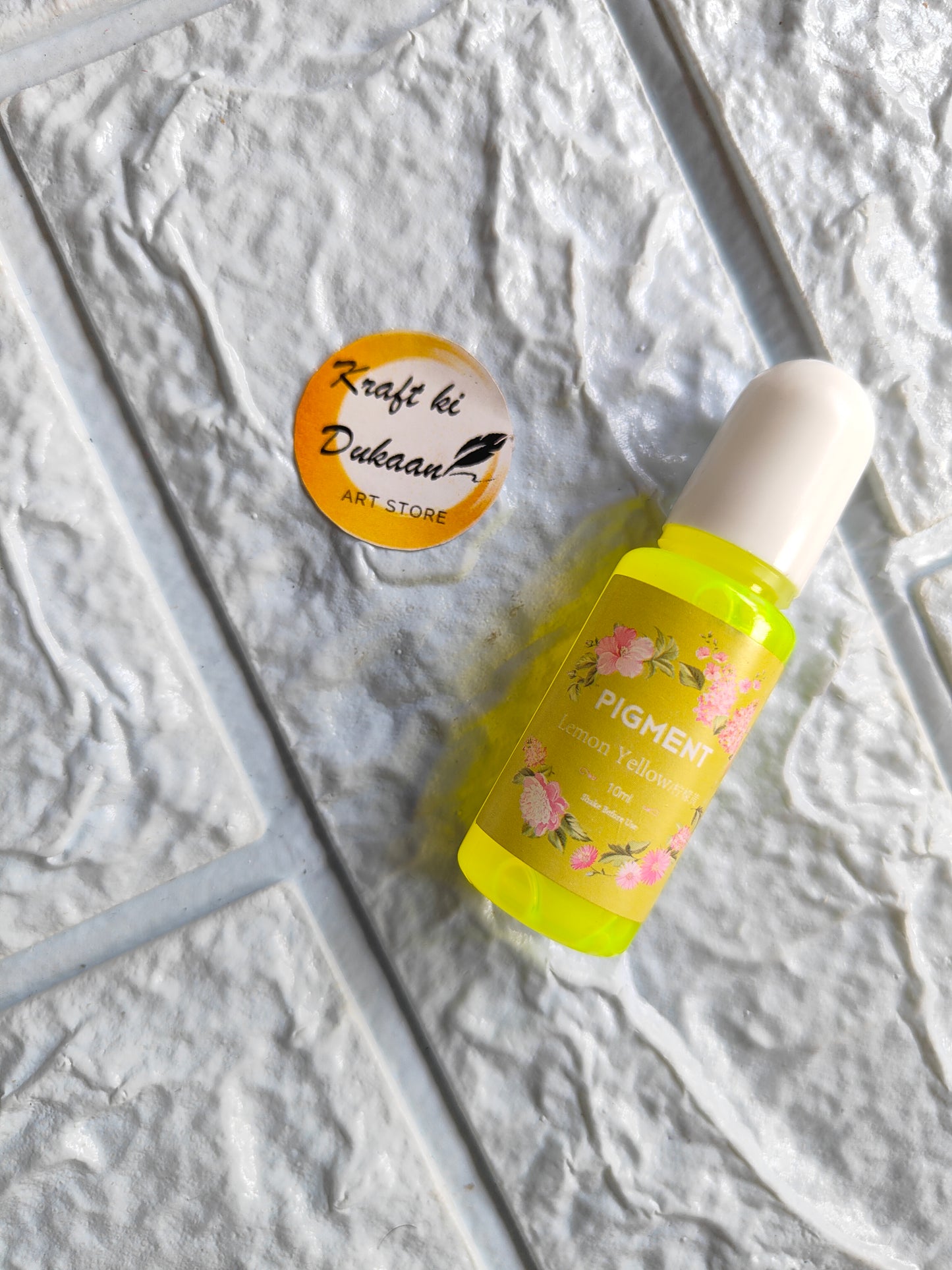 High-quality resin pigment in vibrant yellow bottle for creative crafting projects from Kraft ki Dukaan