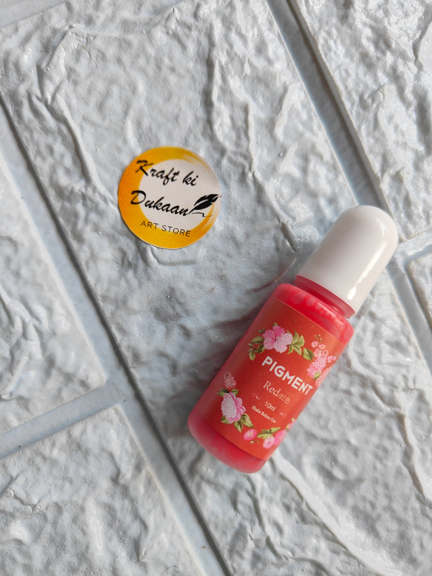 High-quality resin pigment in a pink bottle for vibrant art projects, from Kraft ki Dukaan