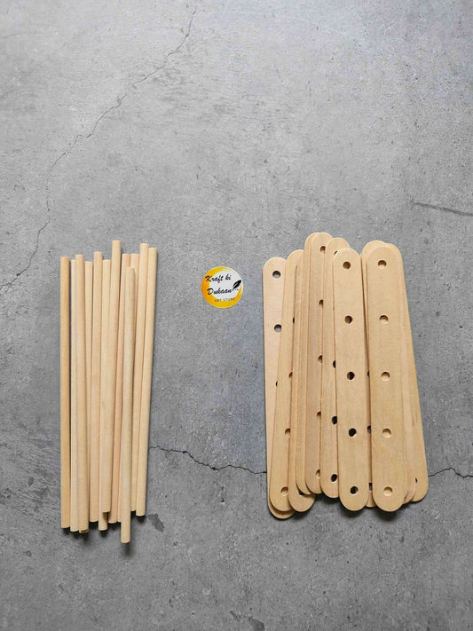 Plain wooden ice cream sticks with holes, set of sticks arranged in bundles