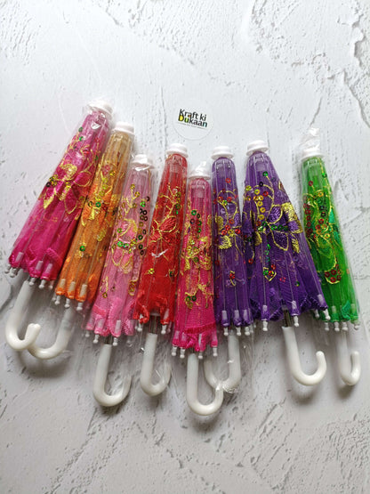 Decor umbrella set with multicolor patterned umbrellas on white hooks