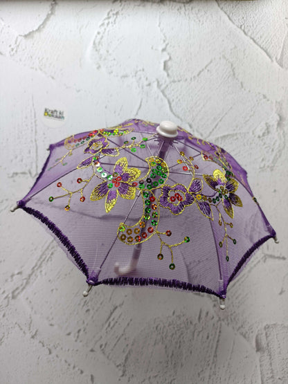 Purple decorative umbrella with floral beaded design and round top cap