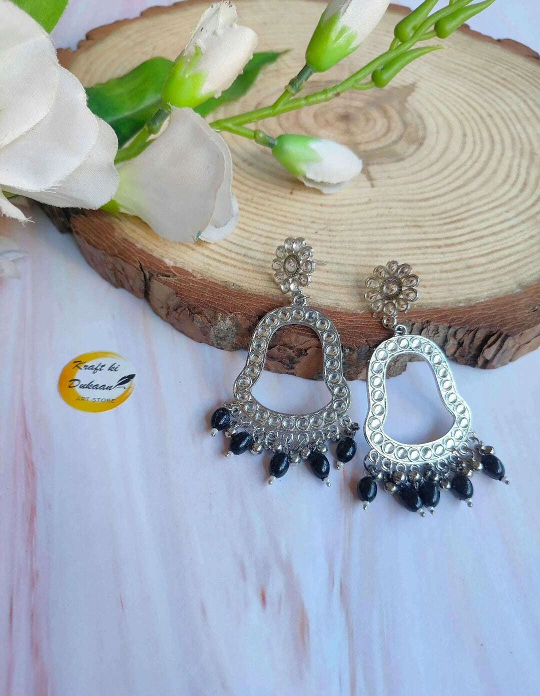 Jhumka drop earrings with silver-toned hoops and dark bead fringe