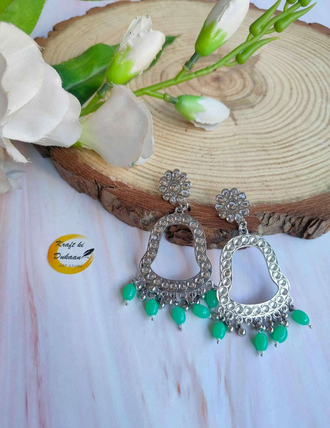 Jhumka drop earrings with silver-toned hoops and sea green bead fringe