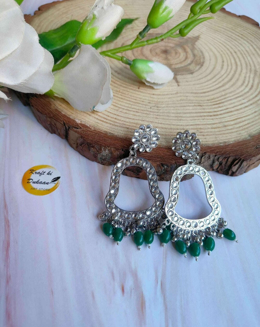Jhumka drop earrings with silver-toned hoops and green bead fringe