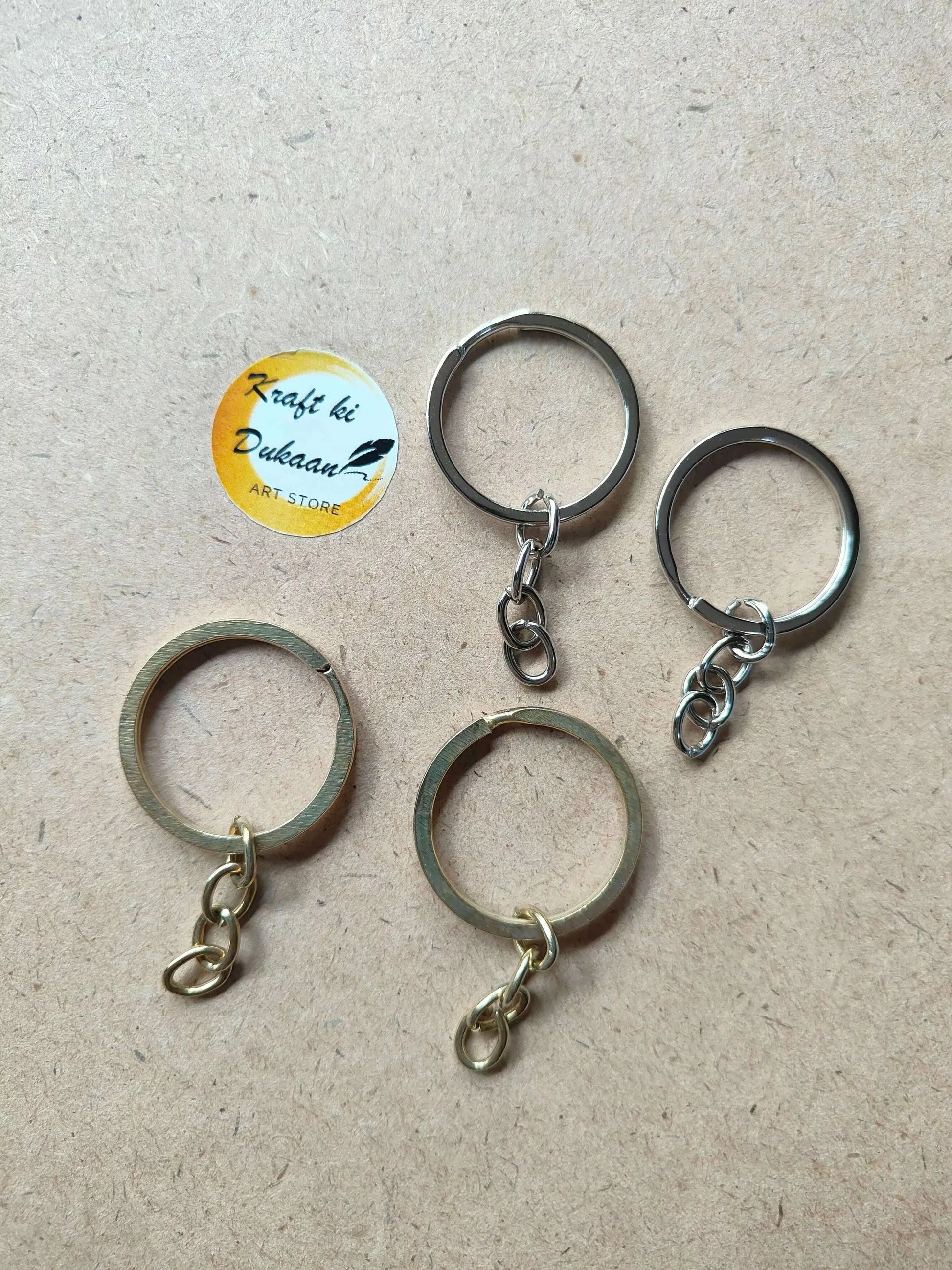 Variety of metal keychain rings in silver and gold, pack of 50 for crafting and DIY projects