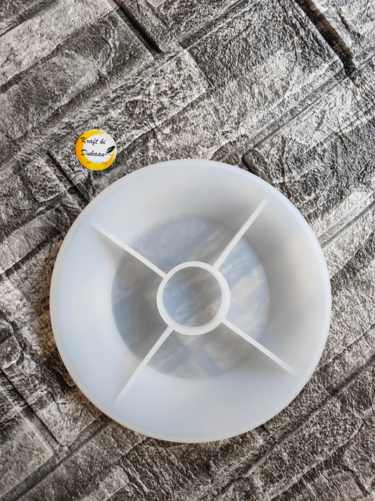 Clear 6 inch plate silicone mould with compartment dividers placed on textured surface by Kraft ki Dukaan