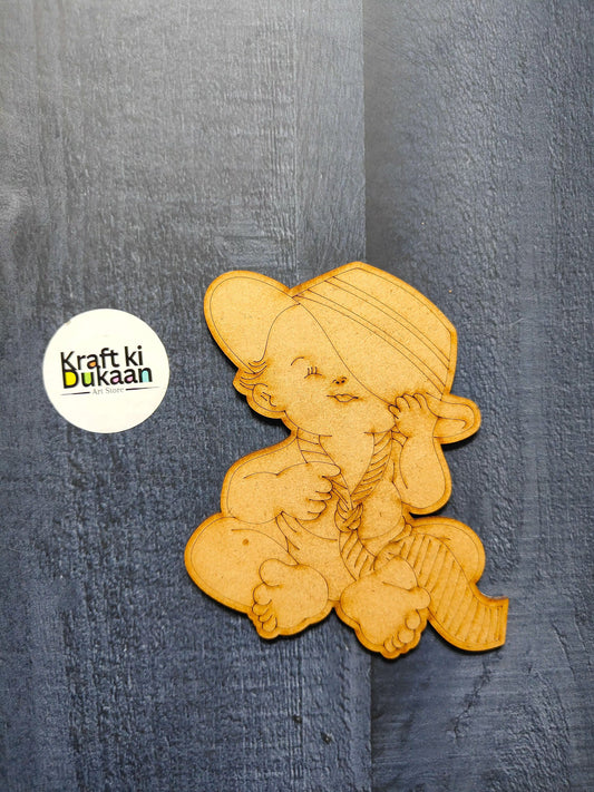 Engraved MDF A7 cutout of smiling child with cap, layered engraved design